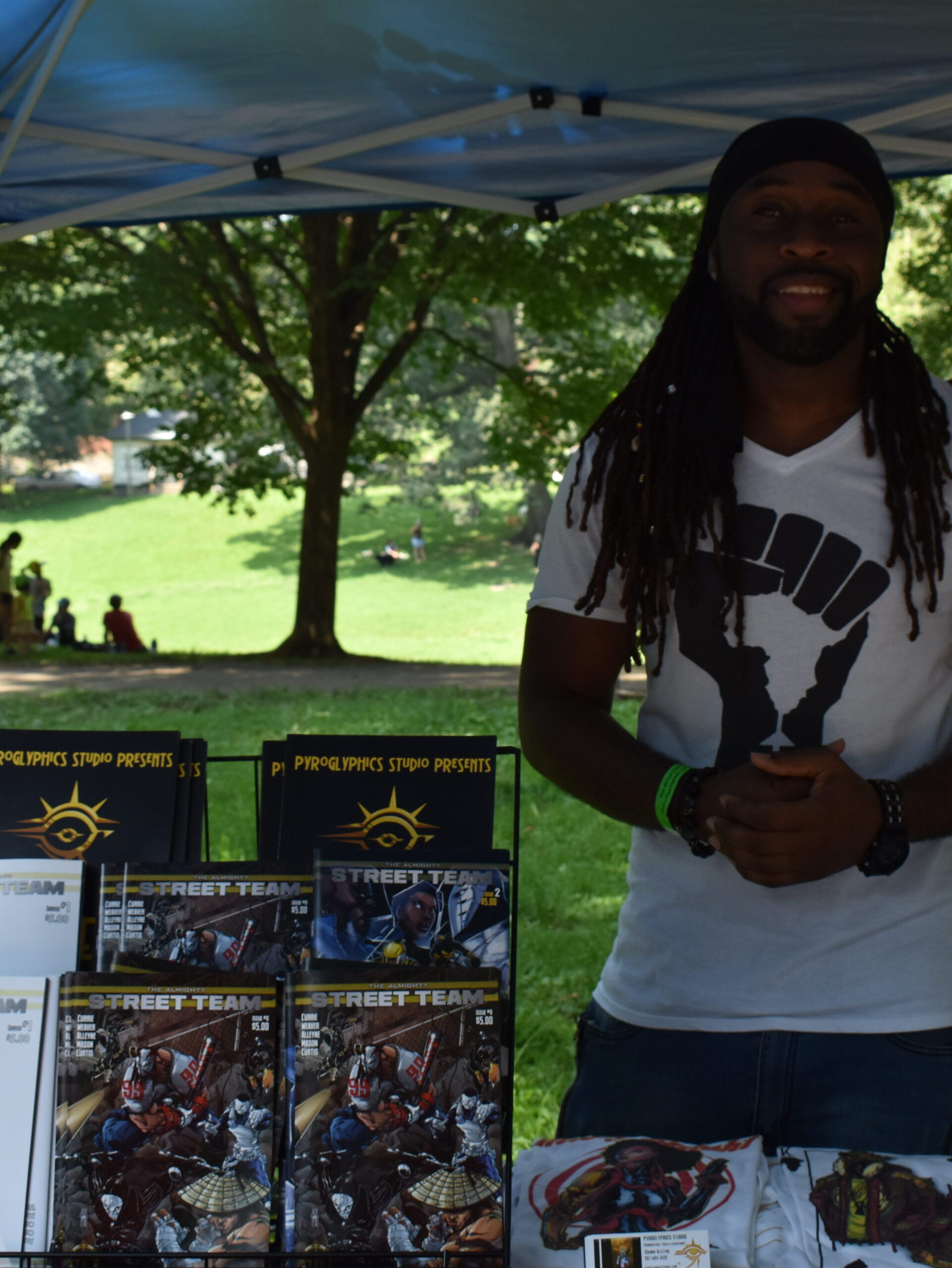 black male vendor standing at his booth